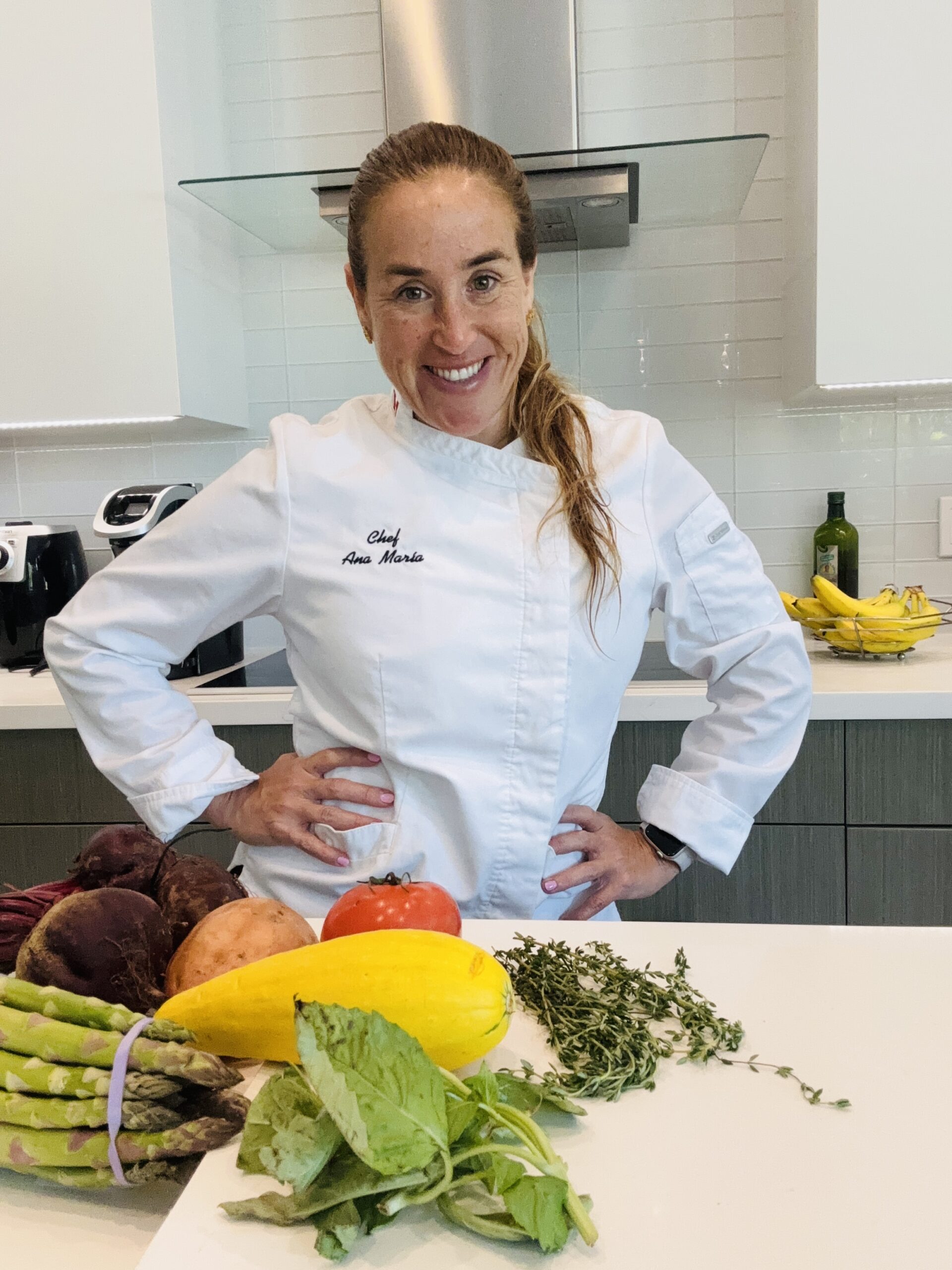 Female chef with fresh vegetables here | ANA MARIA'S CATERING