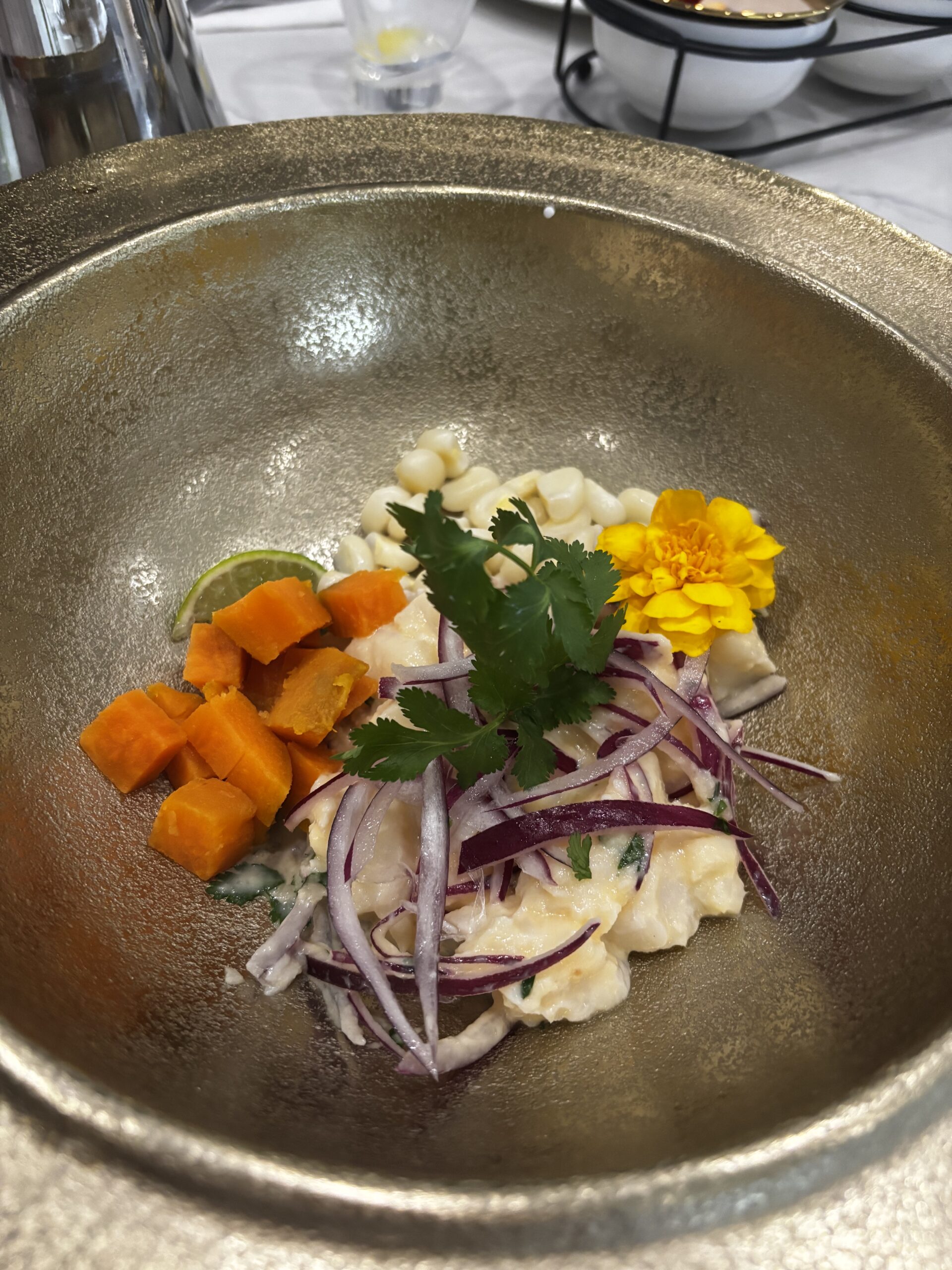 A bowl of ceviche with sweet potato.| ANA MARIA'S CATERING