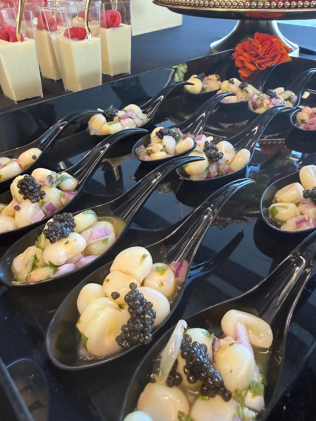 Ceviche tasting spoons finished with caviar